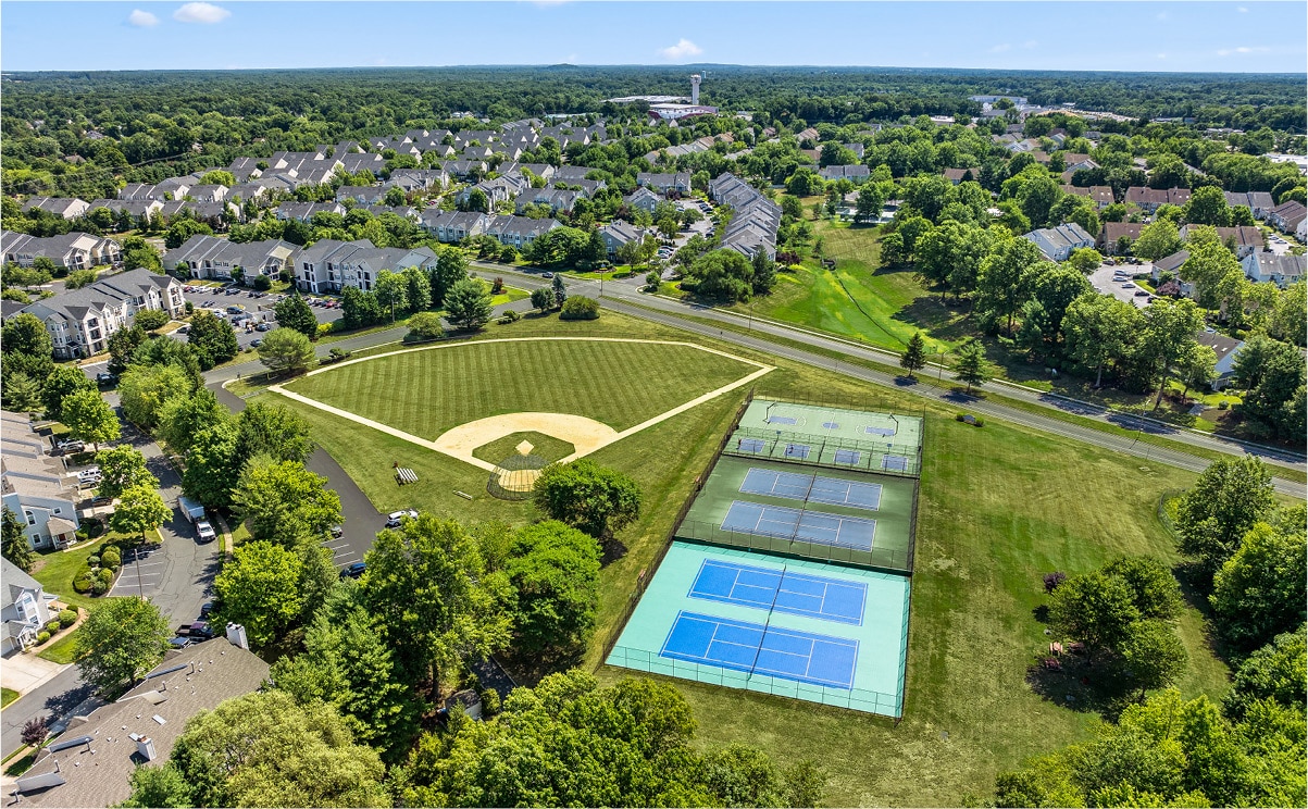 aerial view of summit apartments and the baseball diamond, tennis and basketball courts